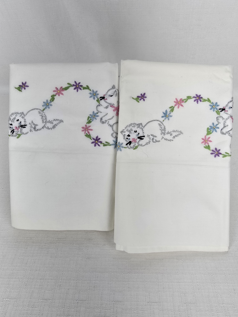 White Vintage Hand Stitched Kitten Pillowcases with Multicolor Floral Garland